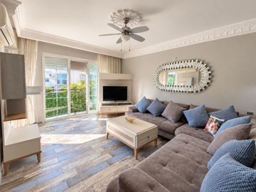 Gorgeous Apartment For Sale In Altinkum, Didim – Fully furnished lounge with a Juliette balcony