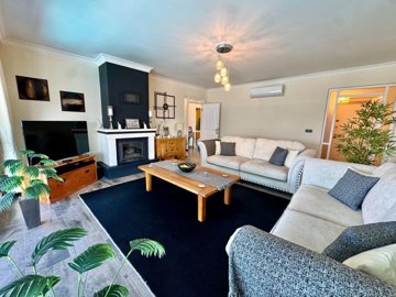 Must-See Fethiye Property For Sale - Lounge with a fireplace