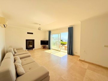 Sea View Villa For Sale In Kadikalesi, Bodrum - Lounge with a modern fireplace