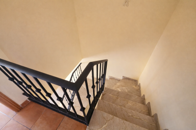 Polished-marble-staircase-with-wrought-iron-railing
